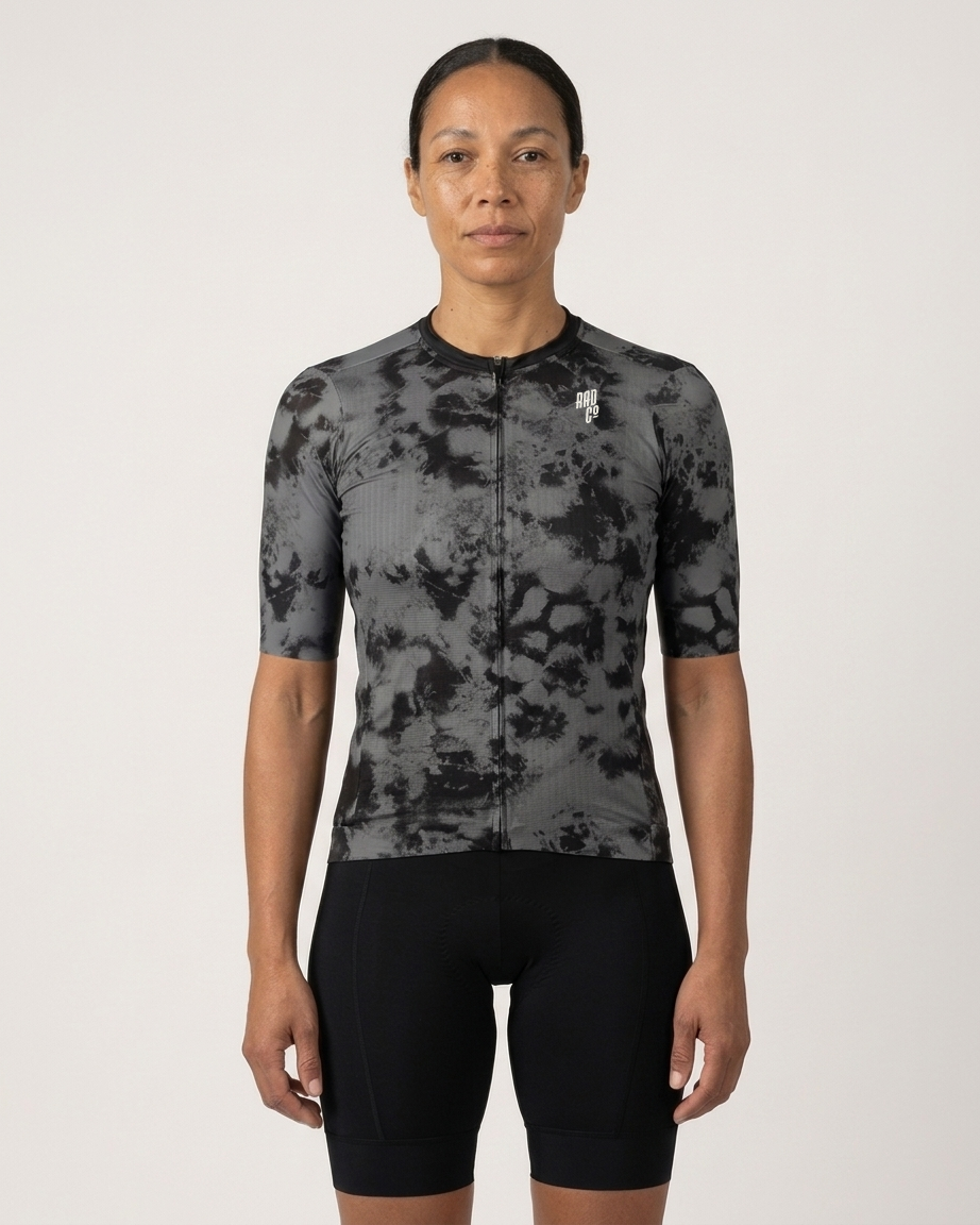 Person wearing a high-end
black and gray pattern cycling jersey on a white background
